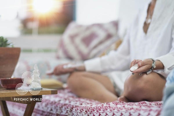 woman spiritual healing with crystal in each hand