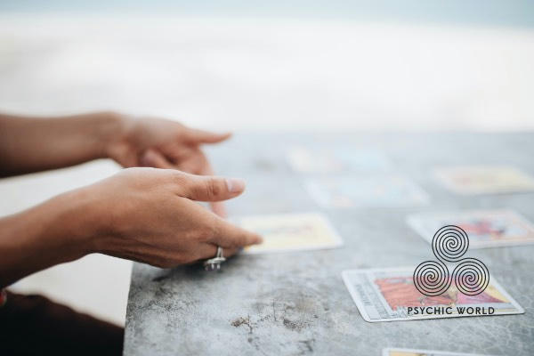 flipping symbolon cards on the beach