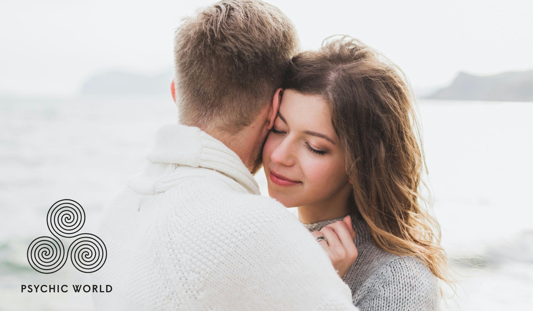 woman hugging a man near the sea