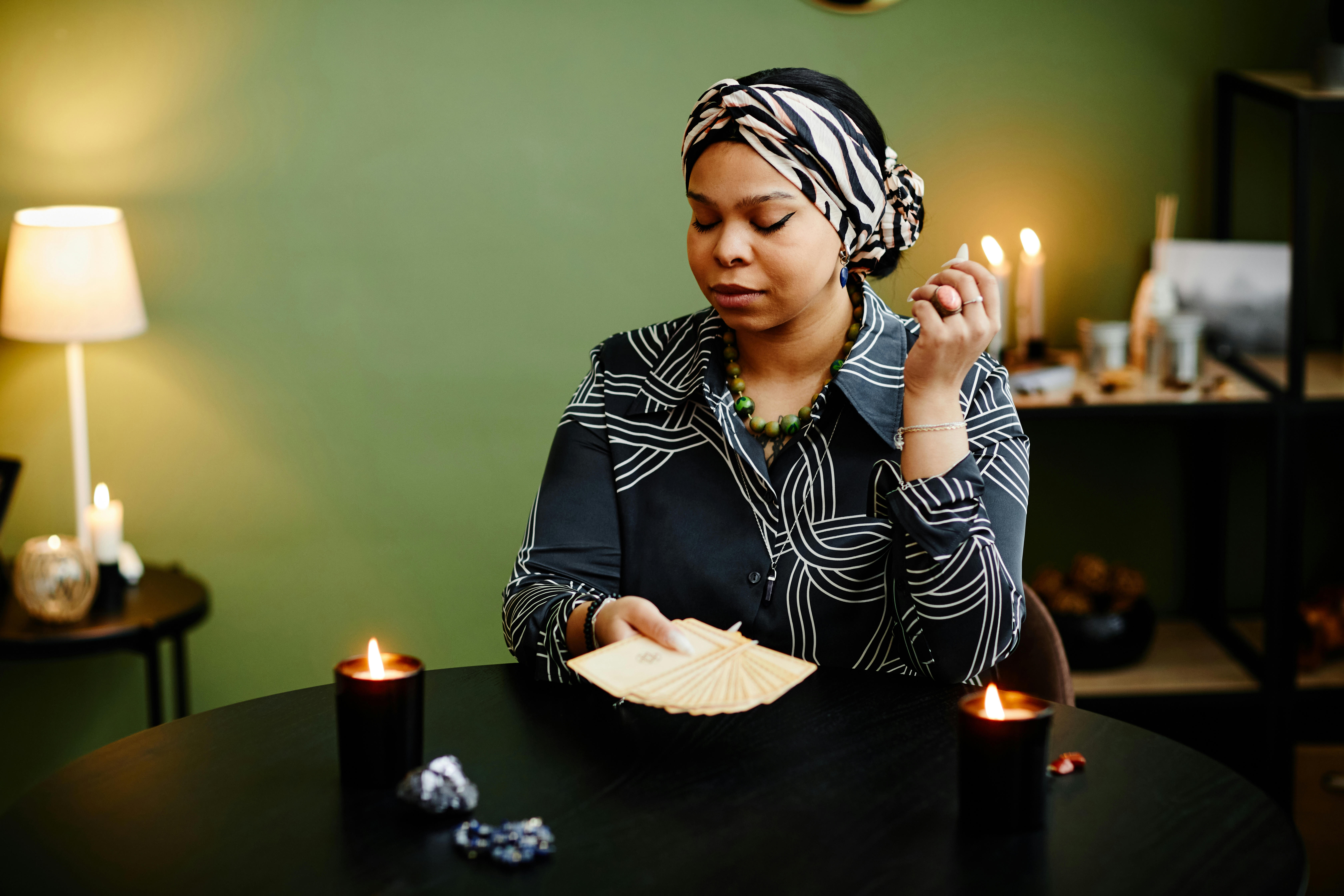 A young psychic dressed in black about to do a reading