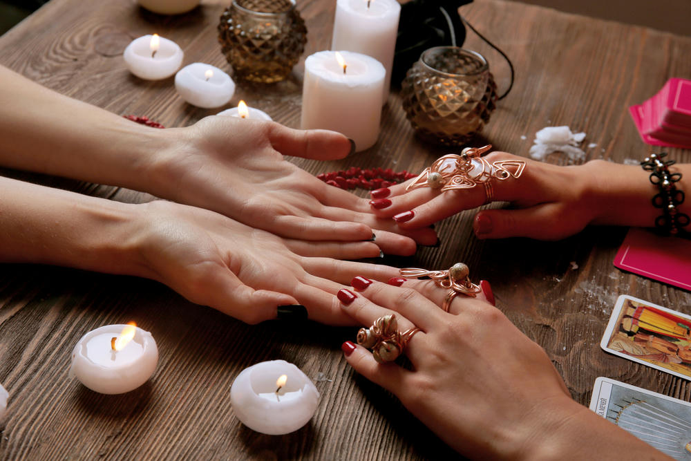 hand reading with candles burning
