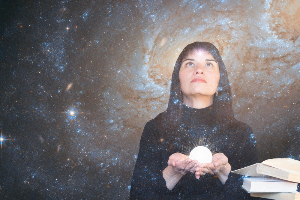 women in space holding crystal ball