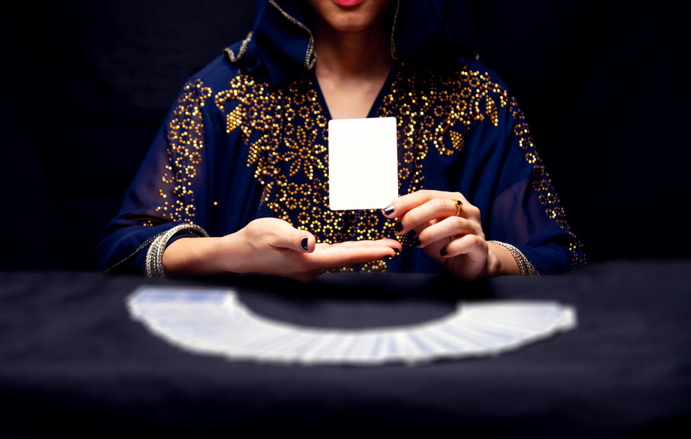Fortune teller's hands and tarot cards.