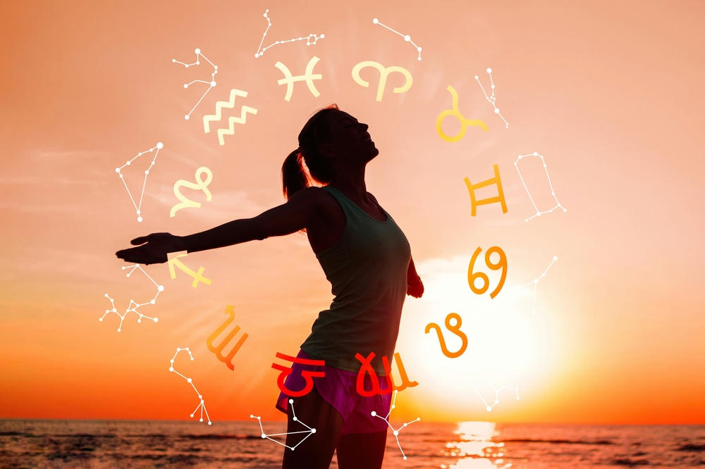  Concept of astrology and horoscope, person inside a zodiac sign wheel.