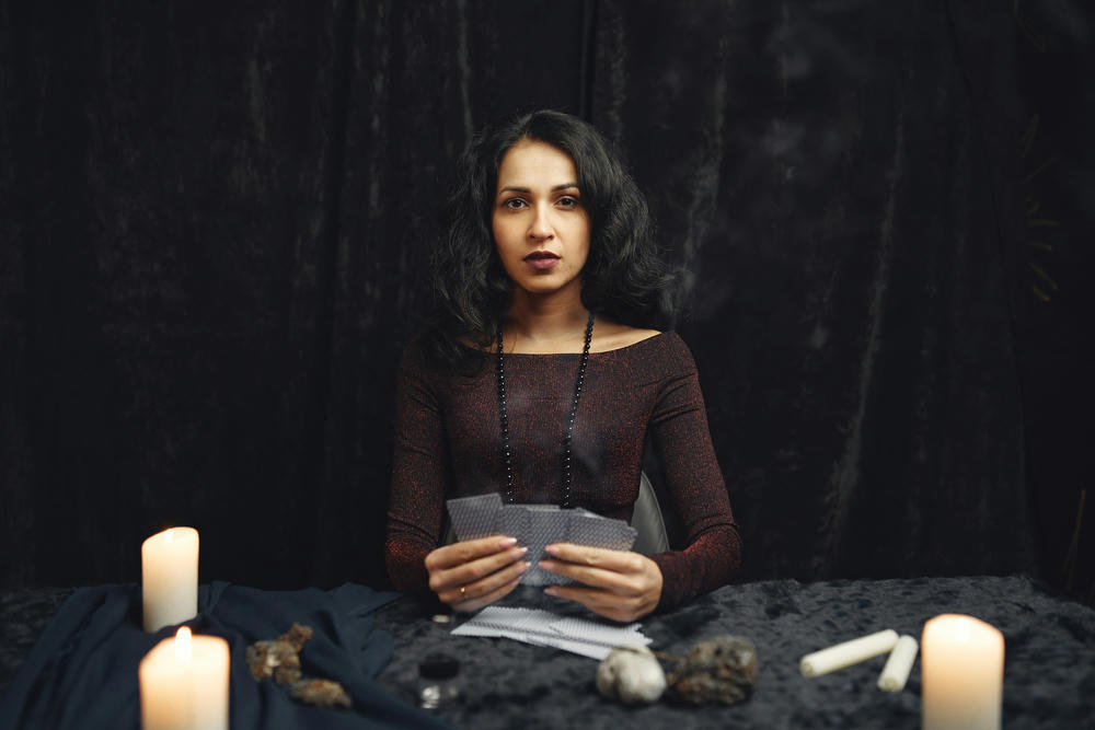 women holding tarot cards