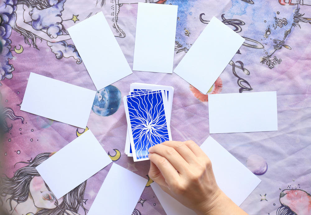 Tarot card reading on cloth for fate or fortune-telling.