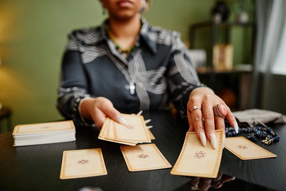 women pulling tarot reading cards